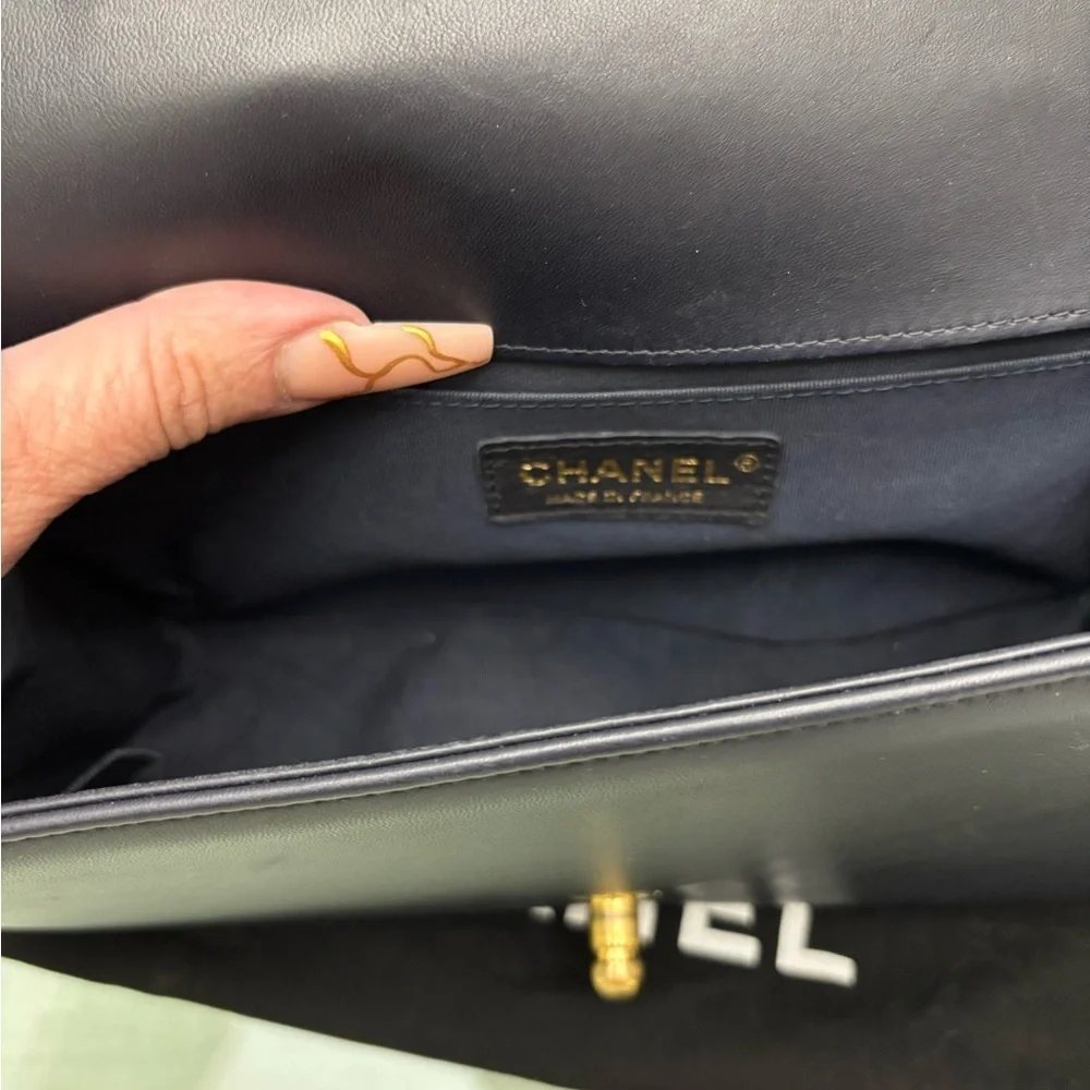 Authentic Chanel Quilted Médium Boy Flap Bag in Navy Blue